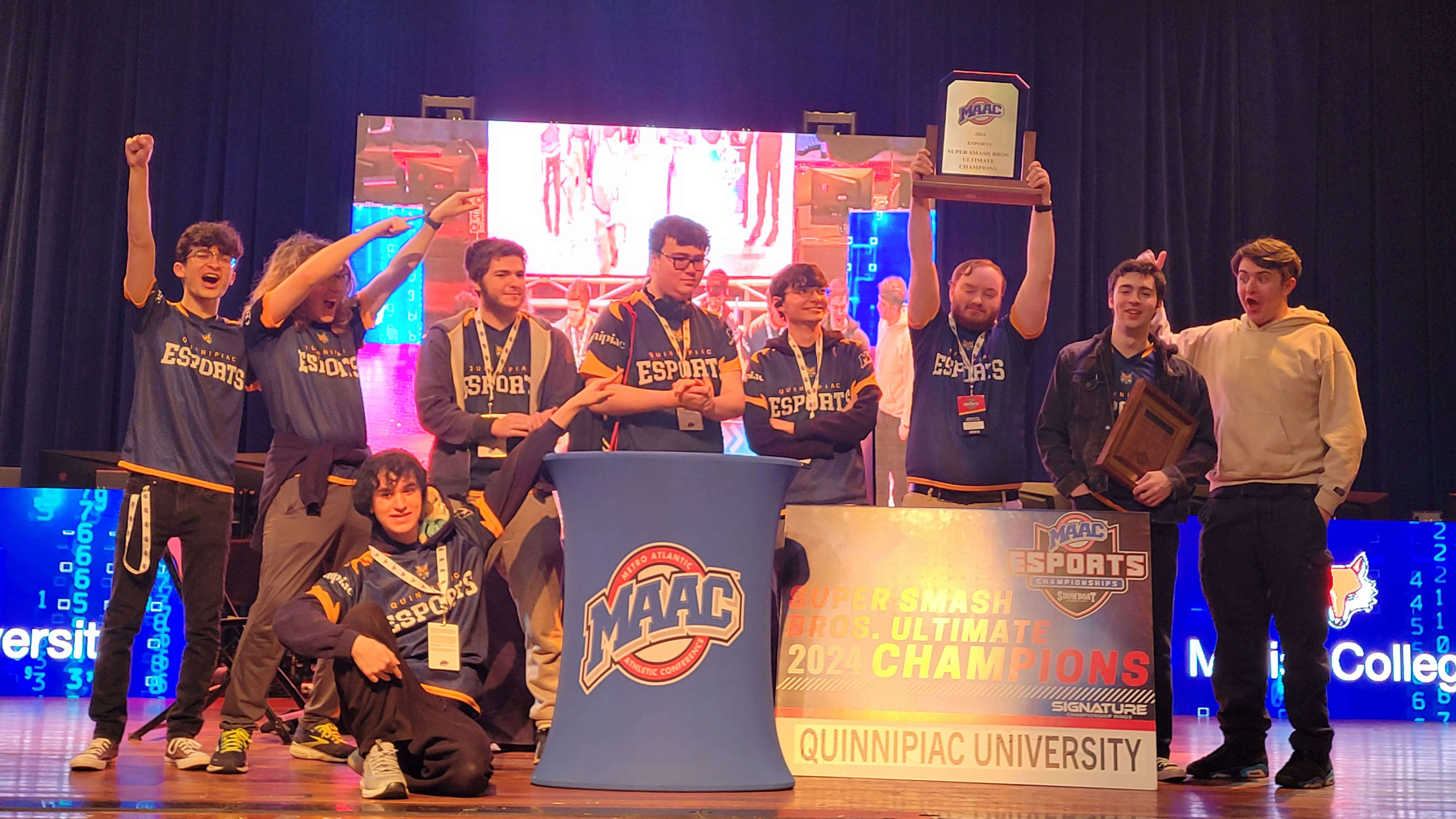 Esports club smiling with the MAAC  Super Smash Bros. Ultimate 2024 Champions sign