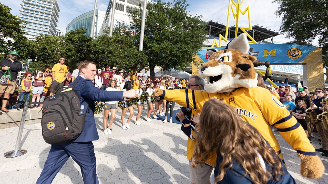 anything Mission surround Pep Band and Ice Cats cheer on the men's ice hockey team in Tampa |  Quinnipiac Today