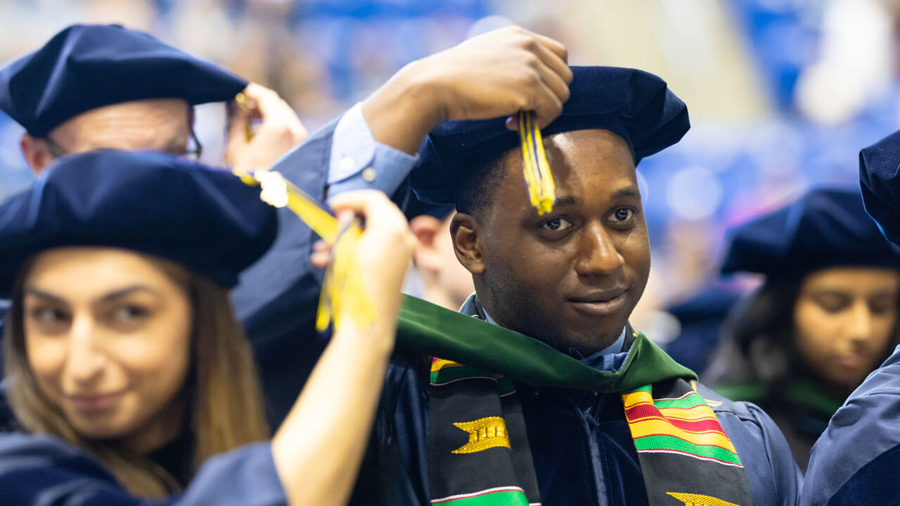 Student flipping his tassel at the School of Medicine commencement