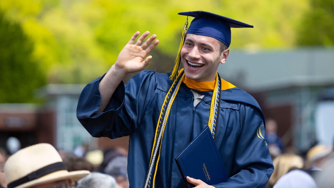 Graduate smiles with great enthusiasm