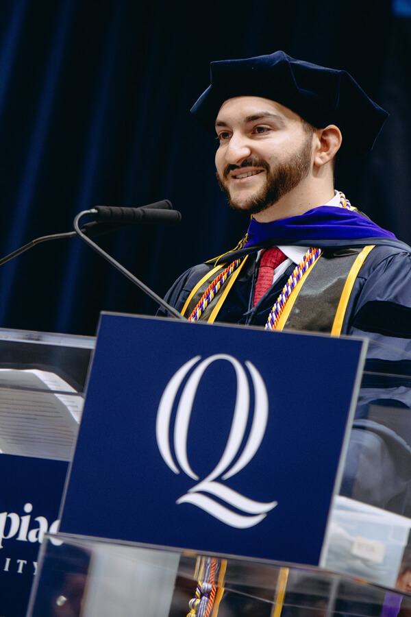 Matthew Ventricelli speaks from the podium during Quinnipiac Law Commencement