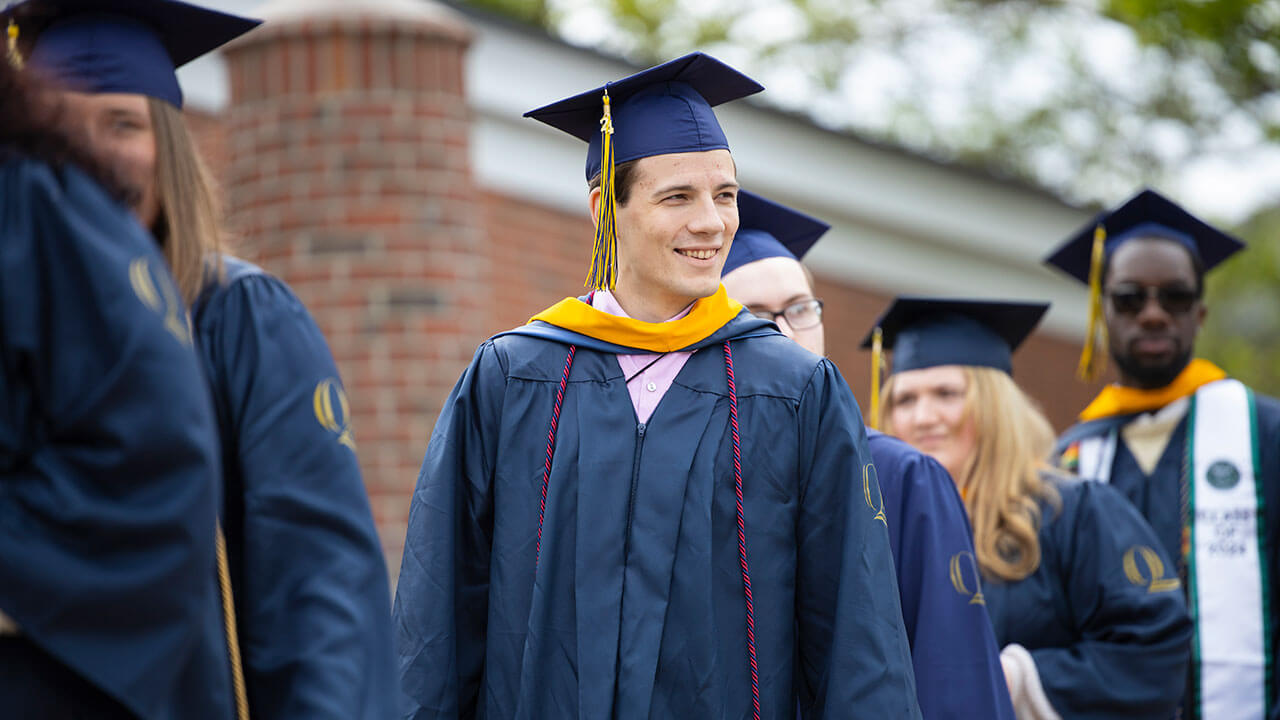 graduate smiles while in line
