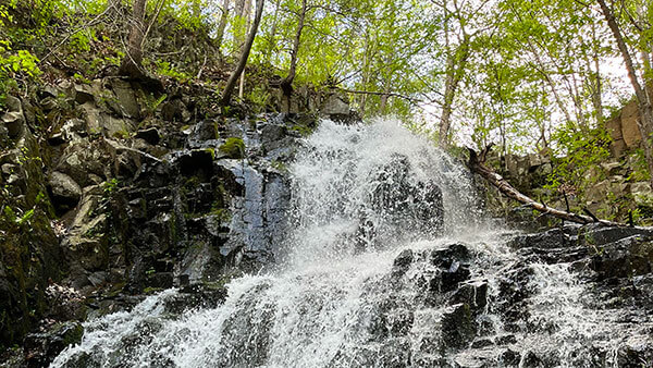 A photo of a waterfall at Roaring Brook Falls in Cheshire, Connecticut