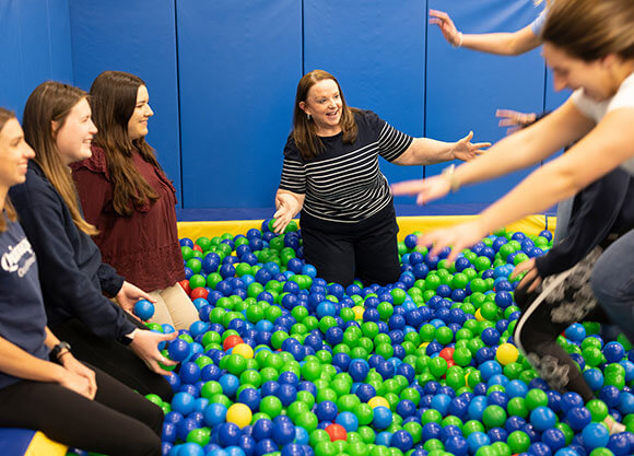 Professor Tara Glennon with students during a movement lab