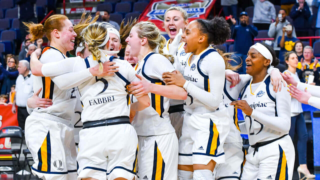 Students celebrate on court during the Women's Basketball MAAC Championship 2018