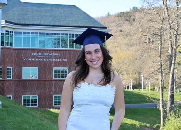 Madison Fahlborg poses wearing graduation cap