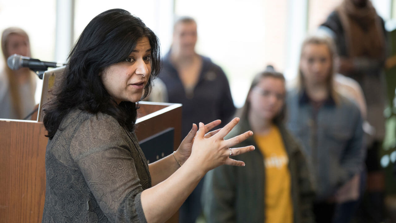 Assistant Professor of Legal Studies Sujata Gadkar-Wilcox engages with students in the Carl Hansen Student Center
