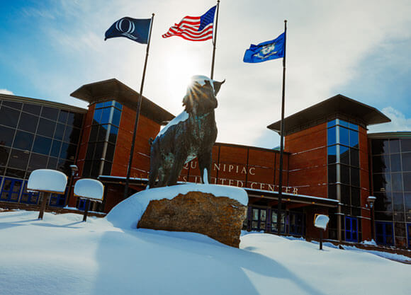 Snow covers Bobcat statue outside of the People's United Center