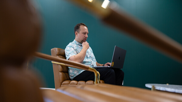 Online graduate student working on his laptop