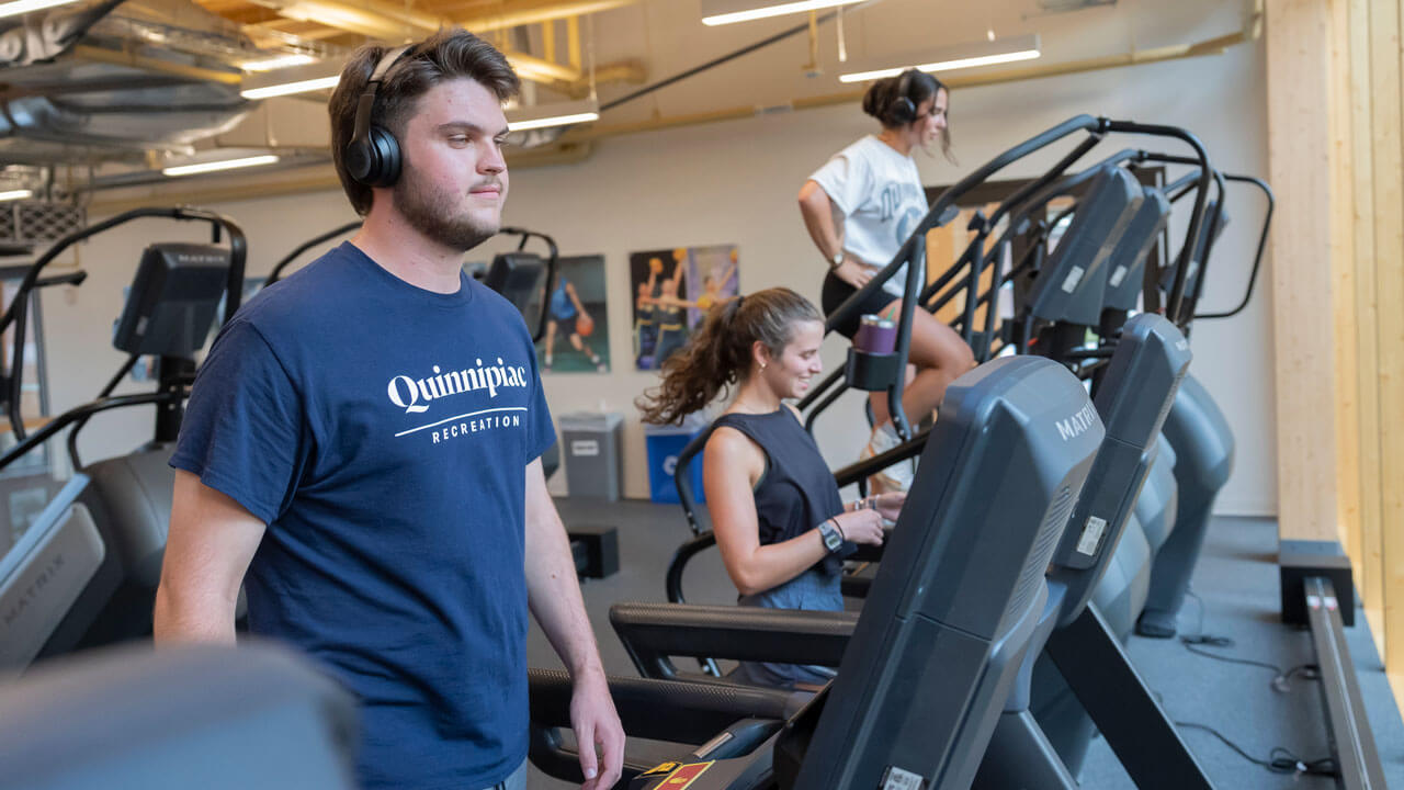 Students walk on the treadmills and equipment at RecWell.