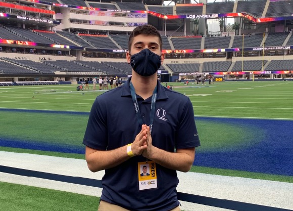 Student standing in football field at superbowl in LA