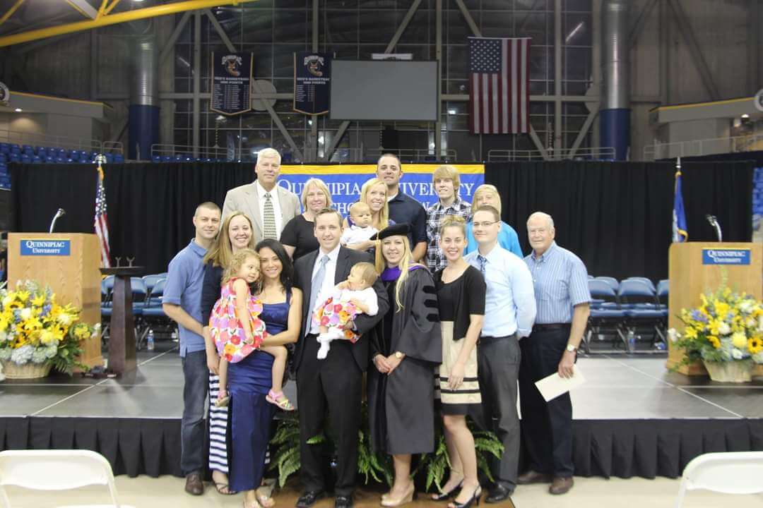 Carolyn Colley, JD '13, poses with her family after graduation