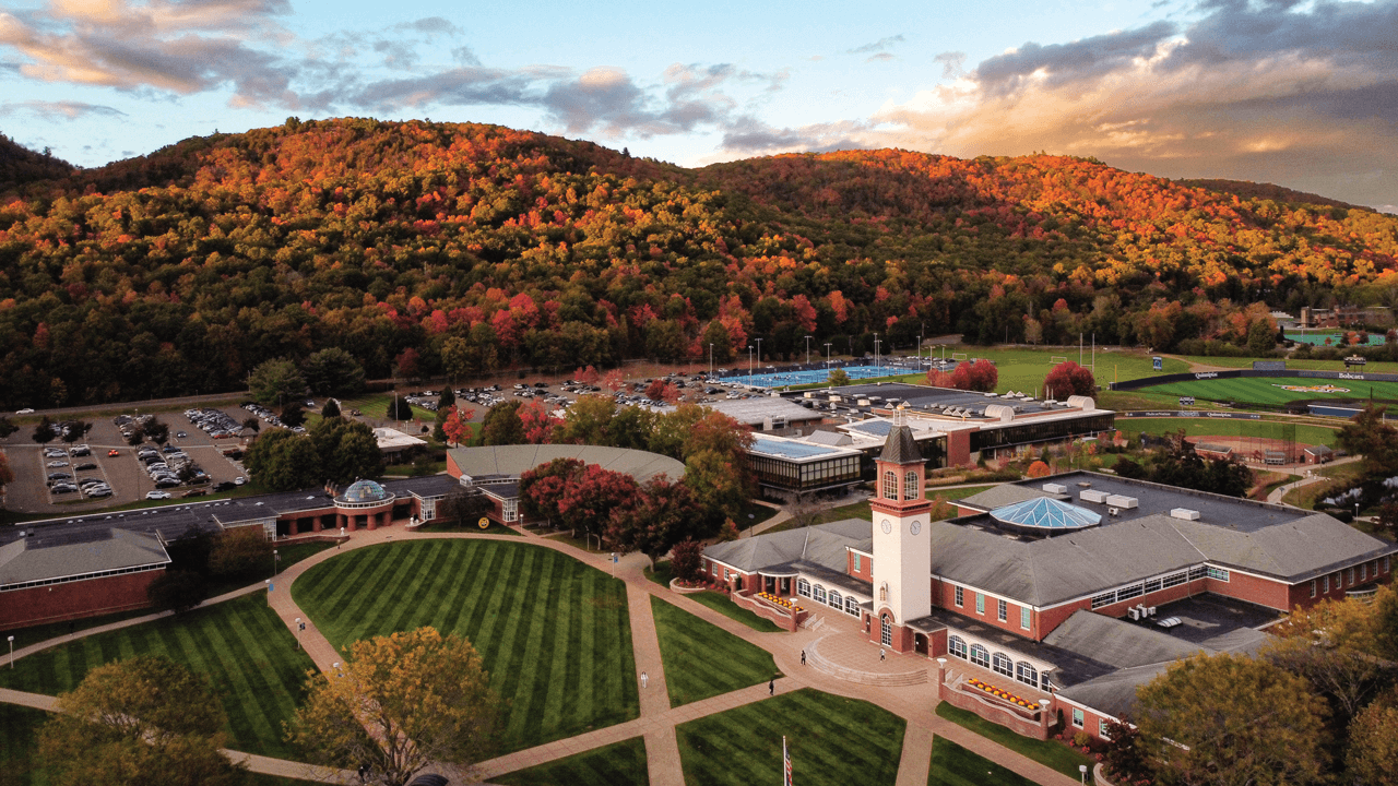 An aerial view of the Mount Carmel Campus quad and library on a fall day with Sleeping Giant