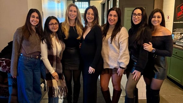Quinnipiac alumna Jessica Grace poses for a picture with several of her alumnae friends