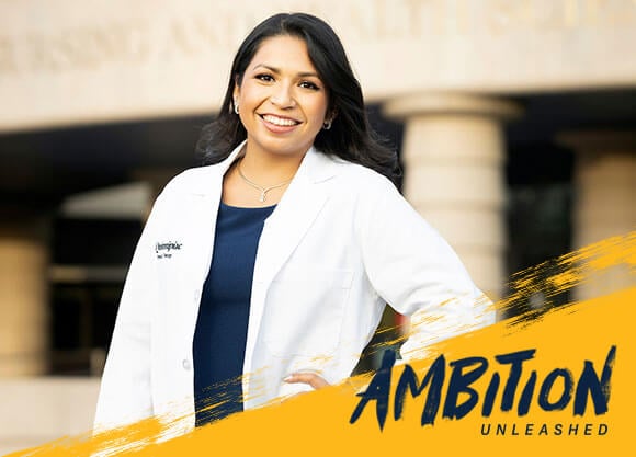 Ambition Unleashed: Nicole Mawhiter wears a white coat outside at the North Haven Campus