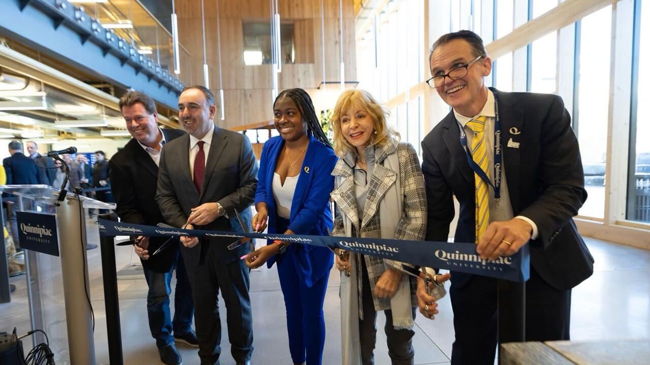 Dignitaries cut the ribbon at the grand opening of Quinnipiac University's Recreation and Wellness Center
