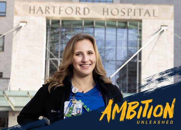 Ambition Unleashed: Emma Raboin wears scrubs in front of Hartford Hospital