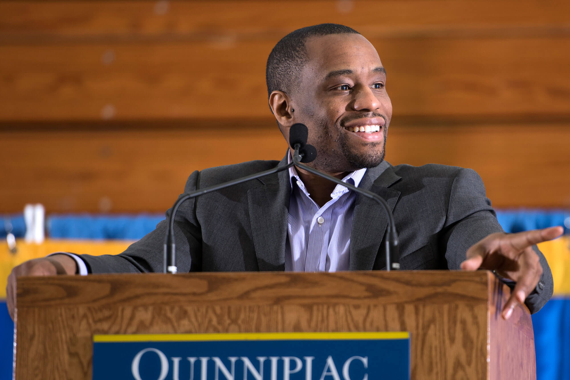 Marc Lamont Hill speaks at a podium during the Black History Month keynote event.