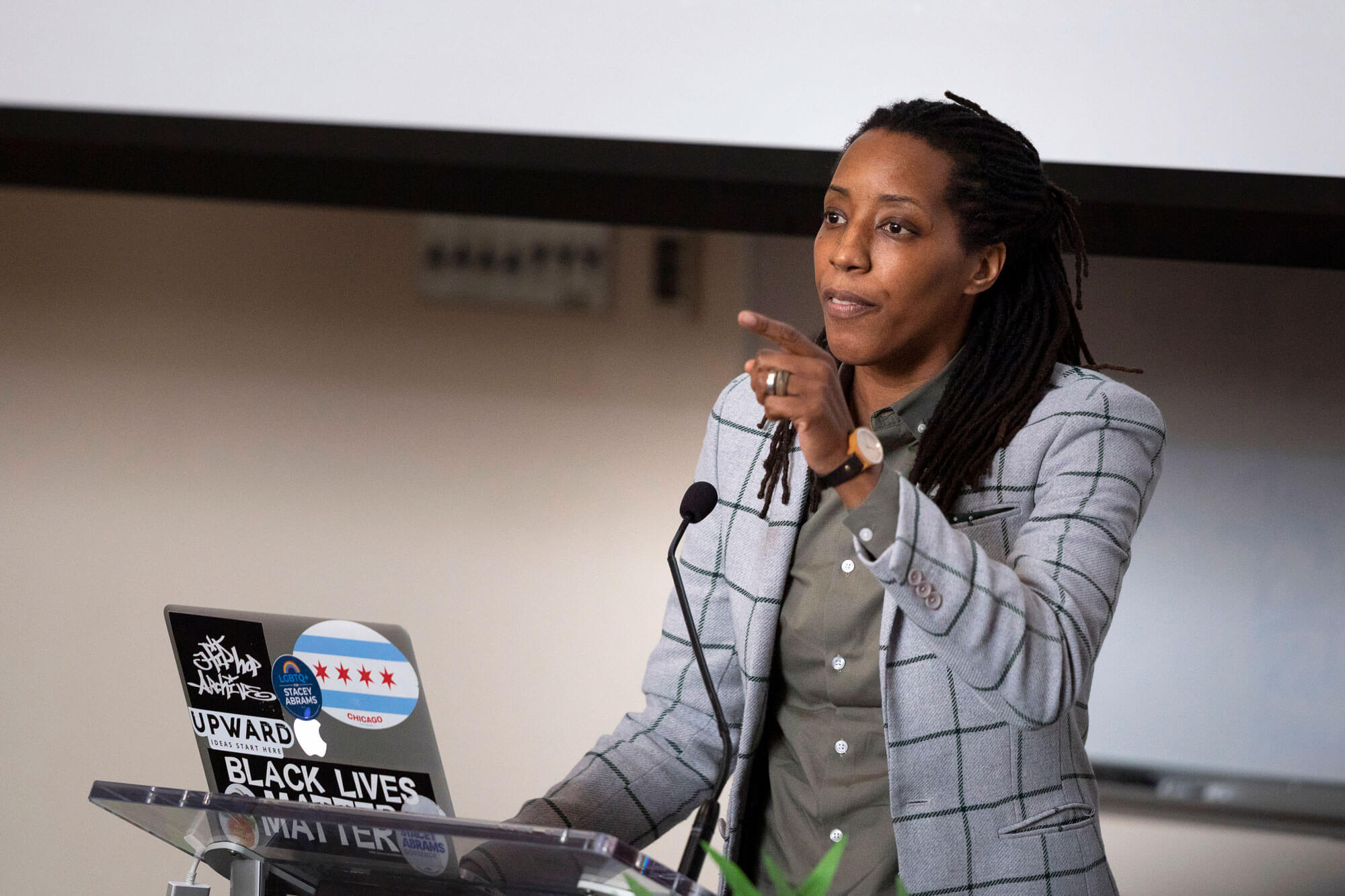 Bettina Love speaks at a podium during the Black History Month keynote event.
