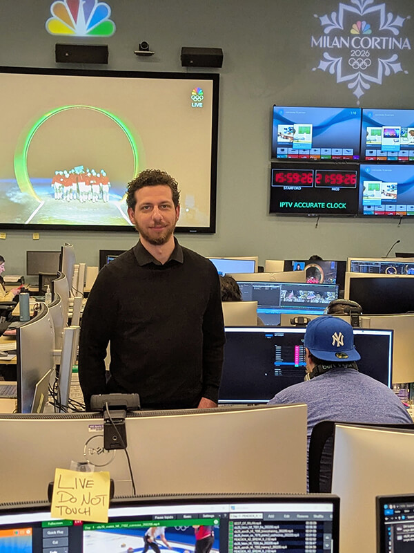 Peter O'Neill '20 posing in a highlight laboratory at the NBC office