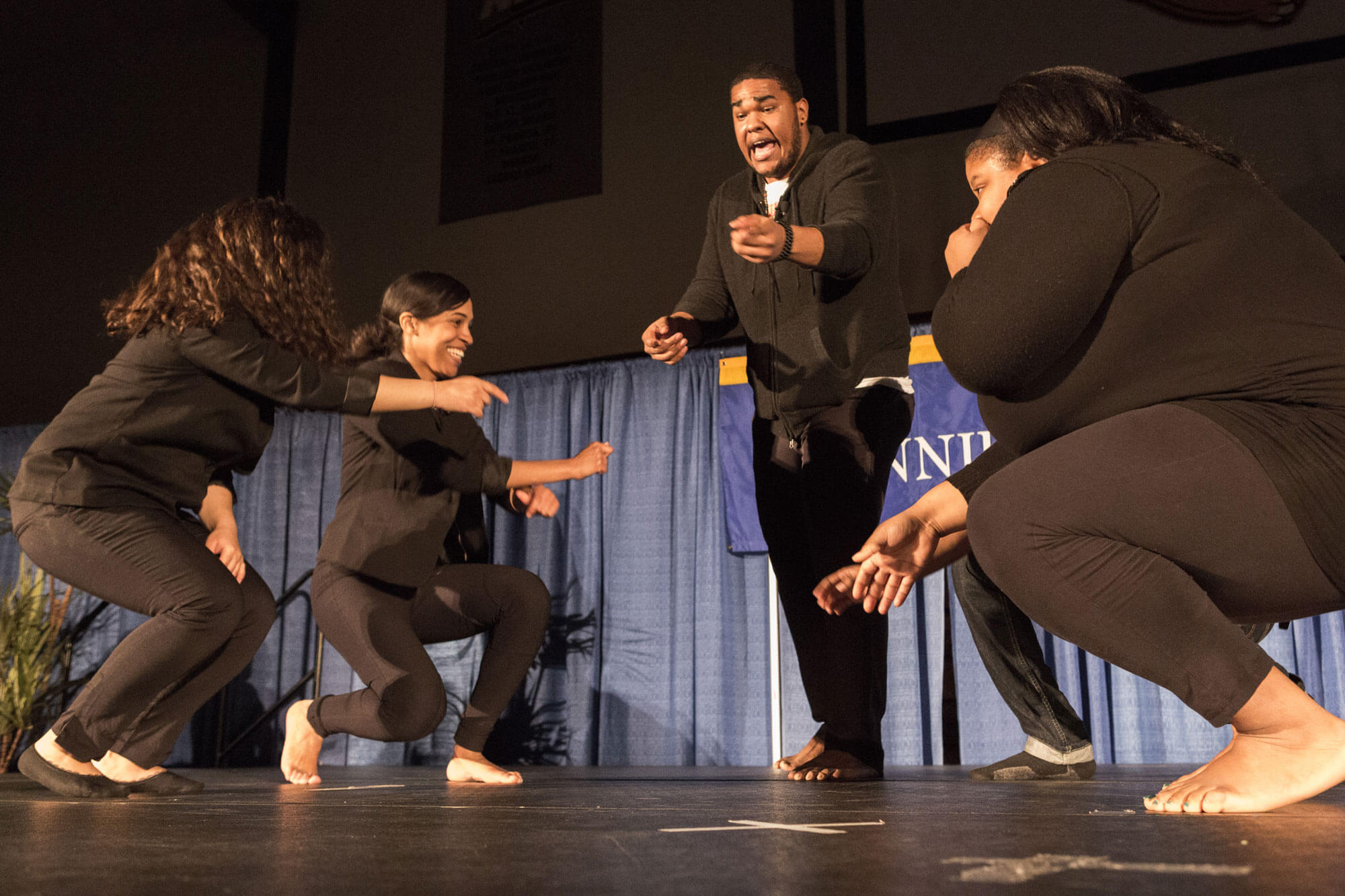 Hip hop performers on stage during Quinnipiac's Black History Month event.