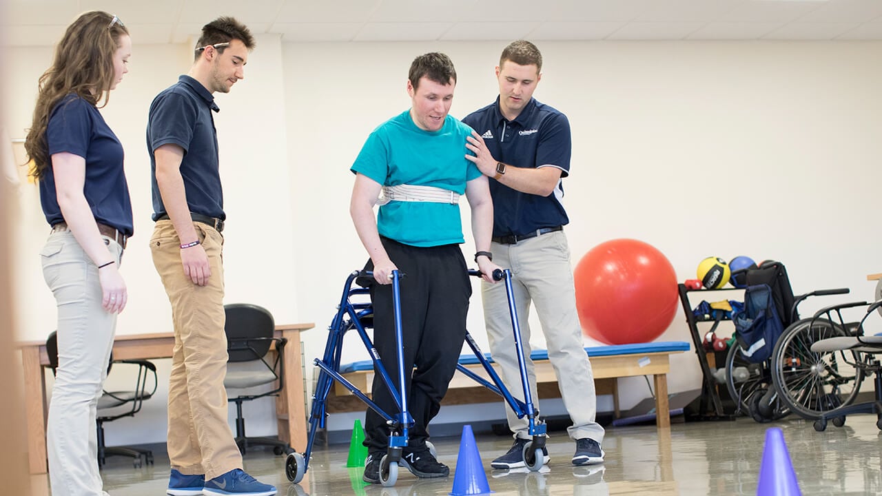 Quinnipiac physical therapy students work with a patient.