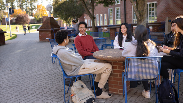 Students sit outside of the Center for Computing and Engineering.