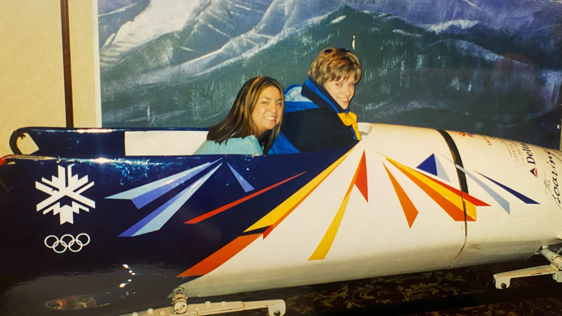 Andrea Luoma sits in a bobsled.