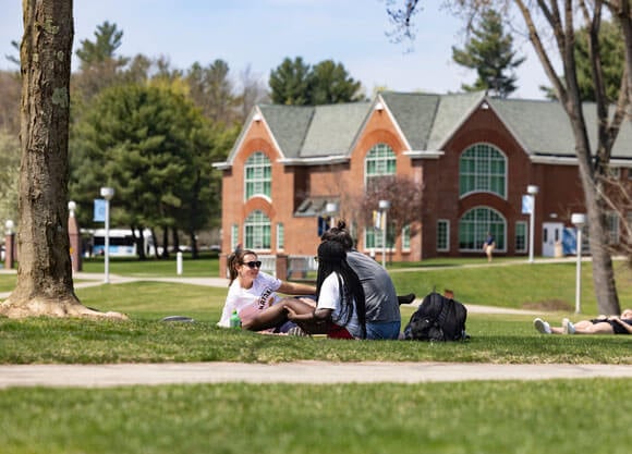 Students sitting on the Quad on the Mount Carmel Campus