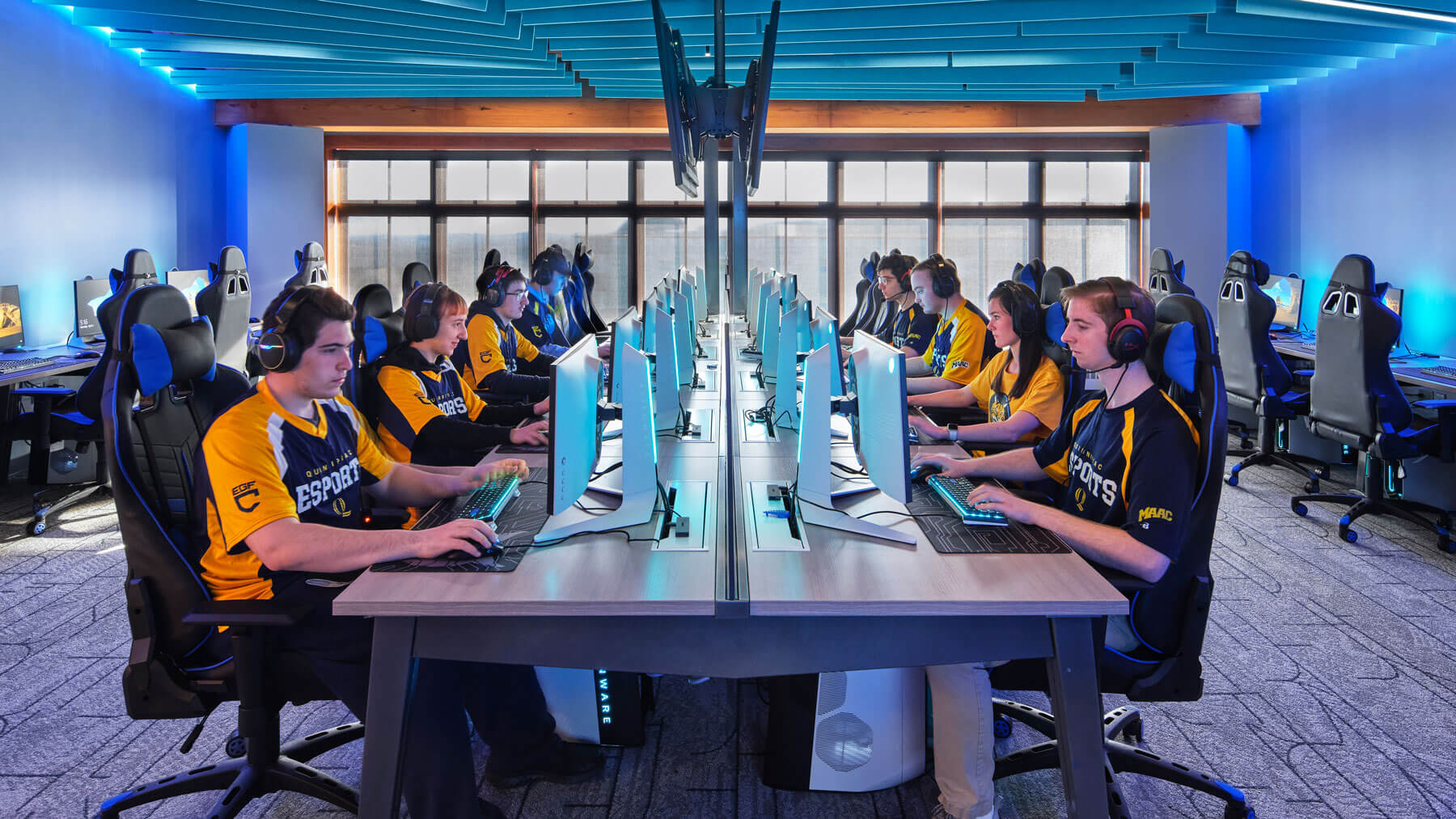 Quinnipiac students play video games in the eSports lounge.