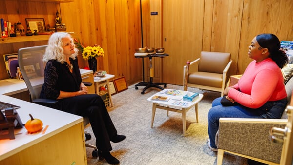 A student speaks with a licensed counselor in her Hartford Healthcare office