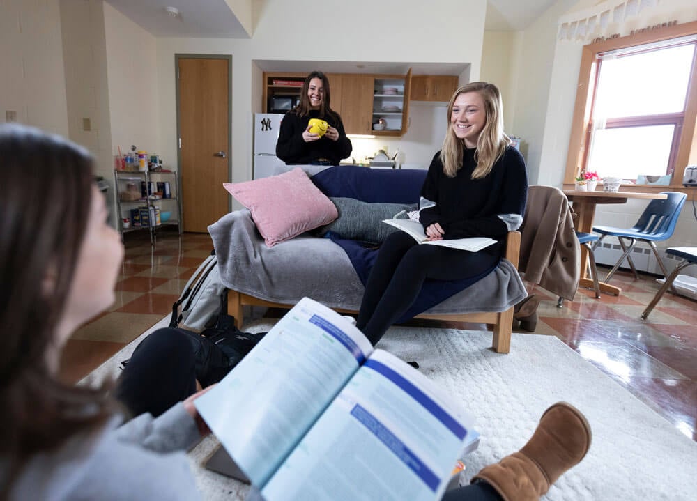 Three students, Kailee Heffler, and Anna Buonomo '20 '21 (3+1) School of Comm, and Diana LaRock '21 Nursing, smiling in their Westview Residence Hall room