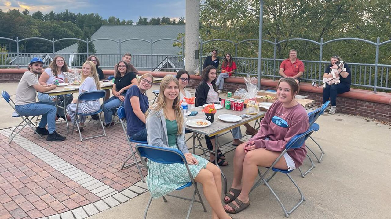 Honors students enjoy lunch outside of their residence hall.