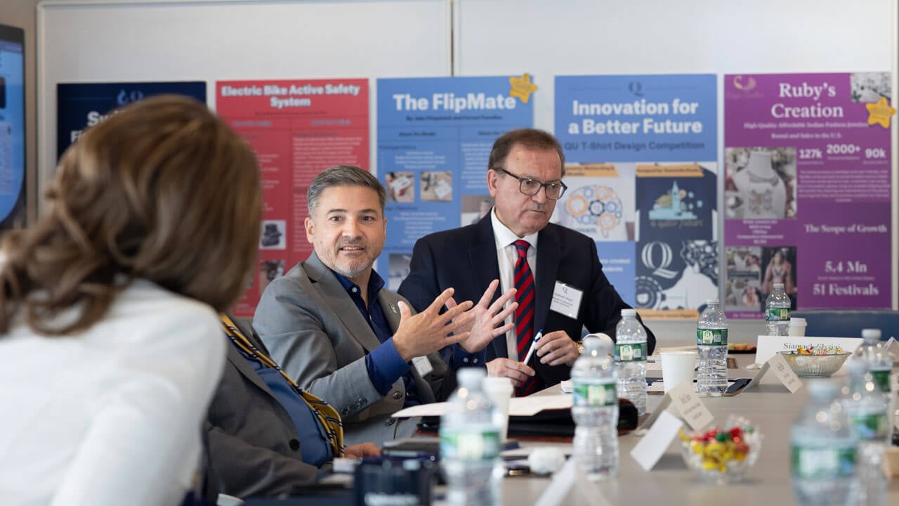 Greg Reilly, University of Connecticut, talks to the group of deans passionately
