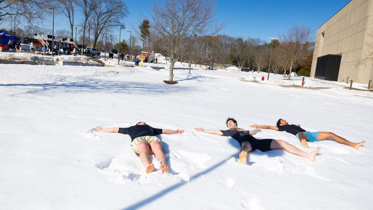 Students jump into snow