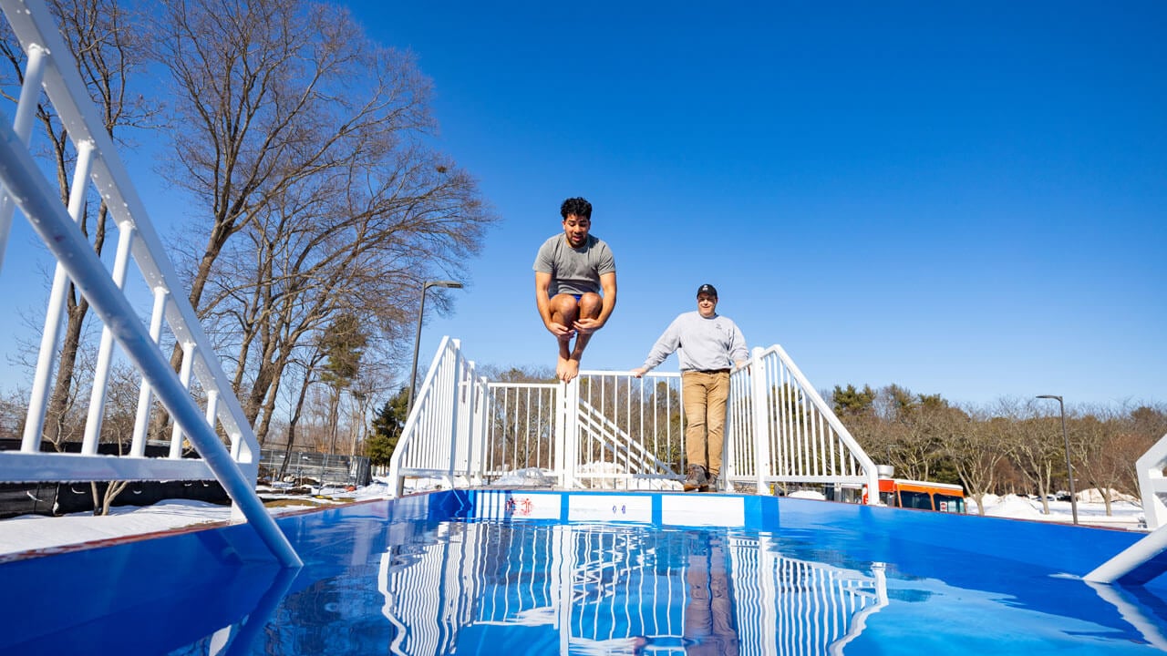 Students jump into polar plunge dunk tank