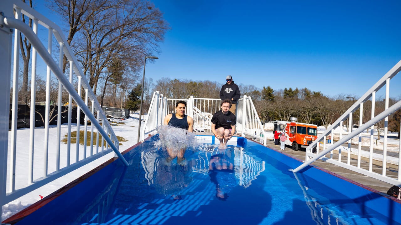Participants jump into polar plunge tank