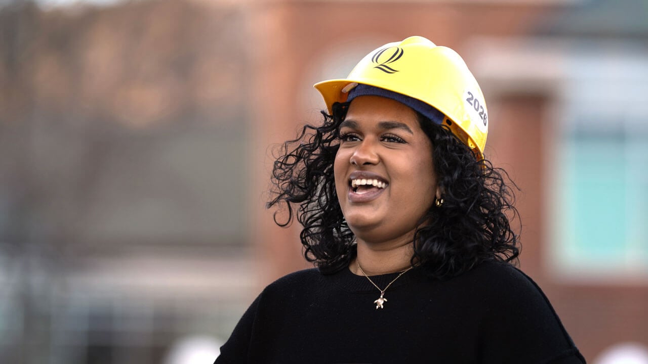 Student smiles with new hard hat
