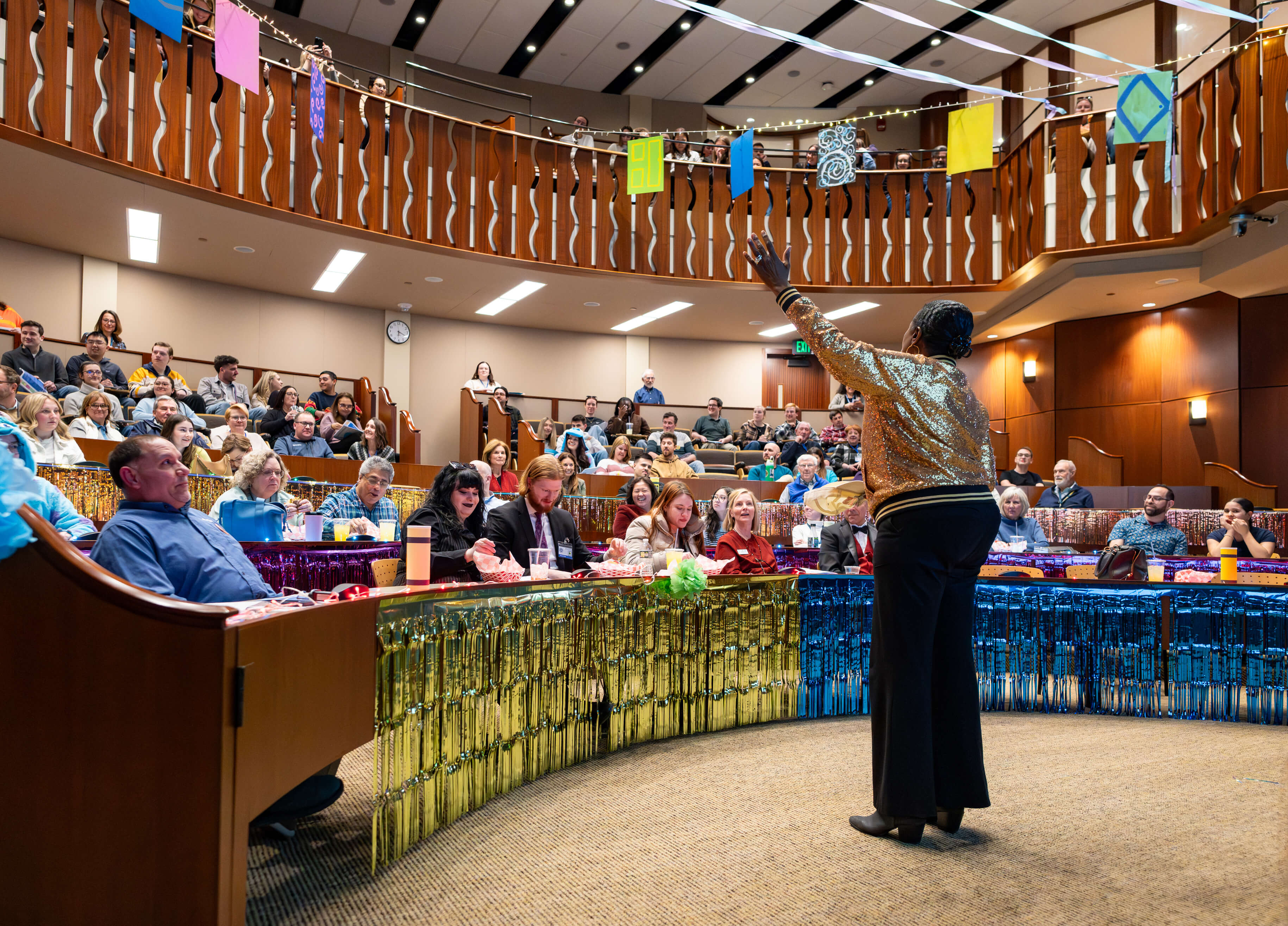 People cheer at the PILP Auction