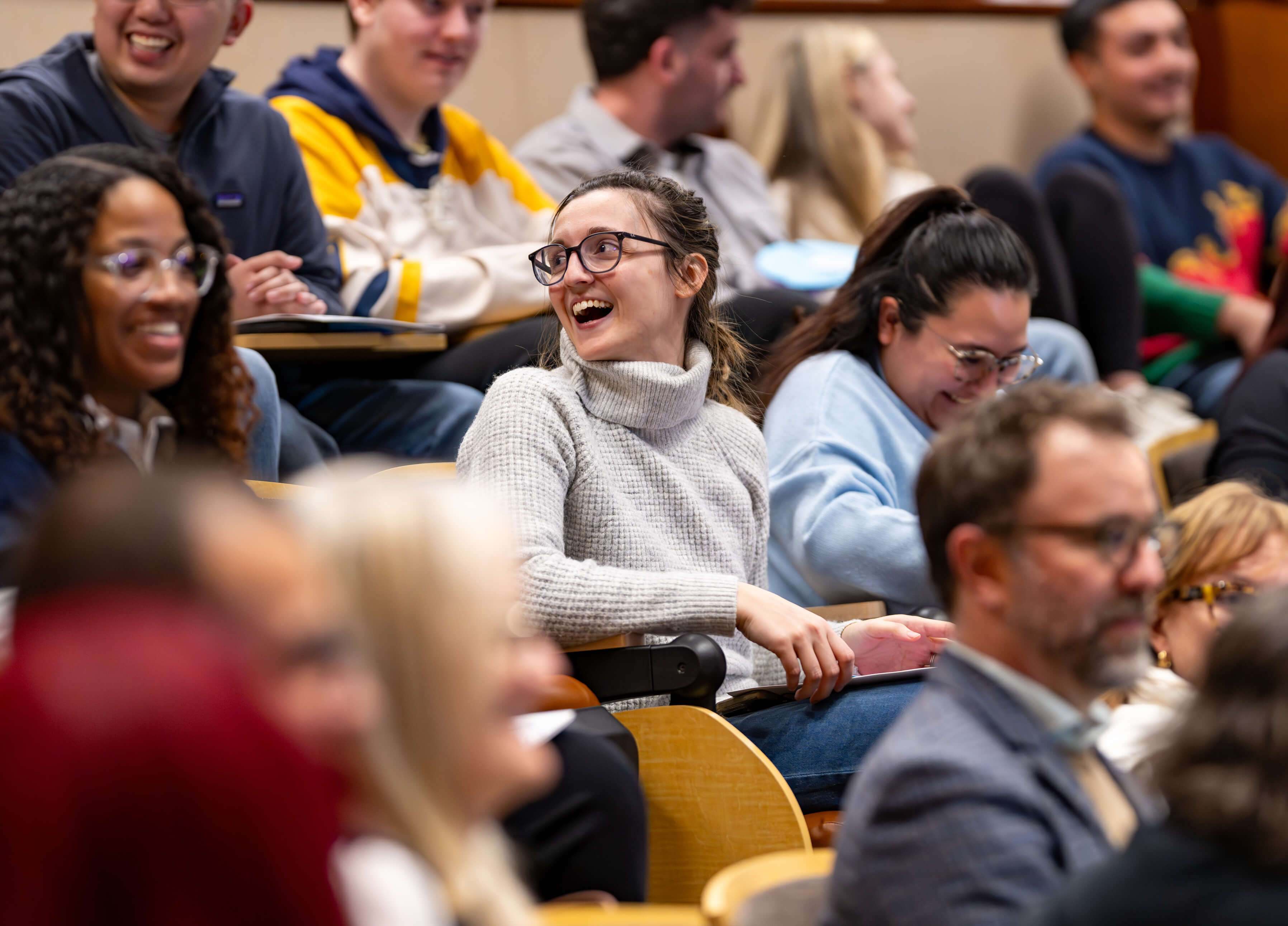 Individual smiles and looks left at the 33rd Annual PILP Auction