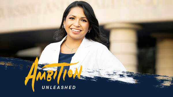 Ambition Unleashed: Nicole Mawhirter stands outside the Quinnipiac North Haven Campus wearing a white coat.