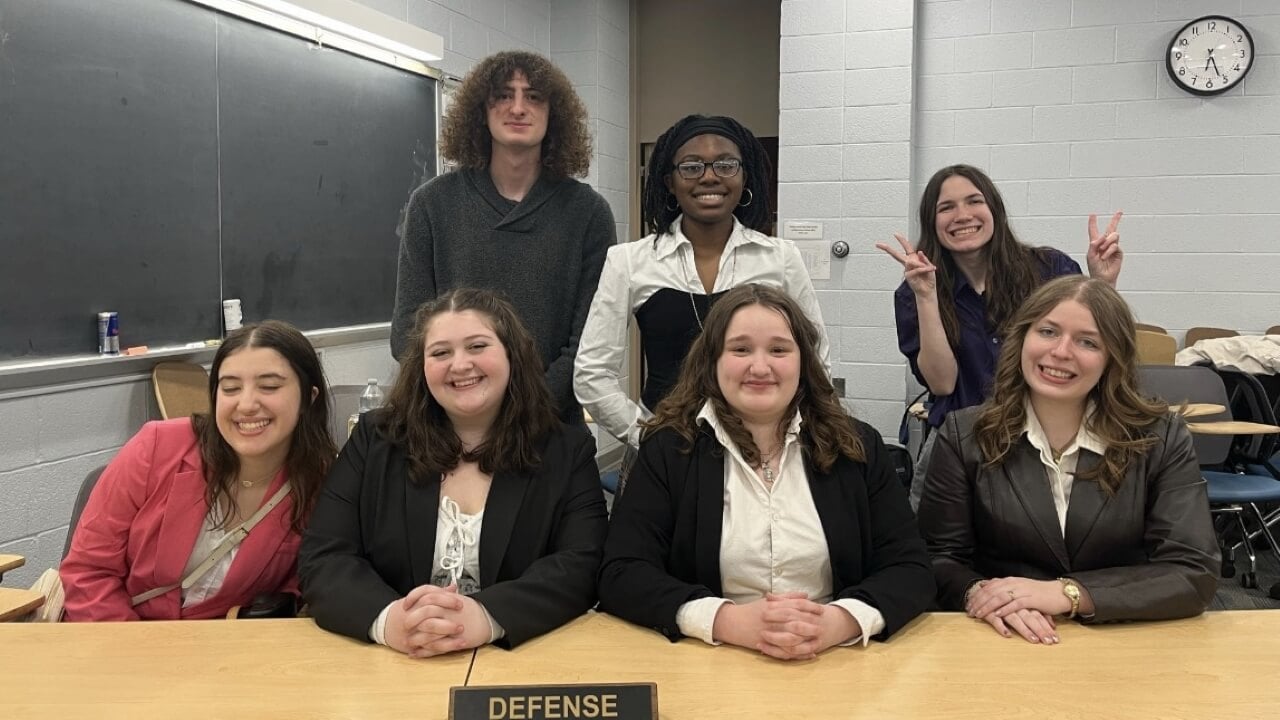 Students taking part in a mock trial as the defense team