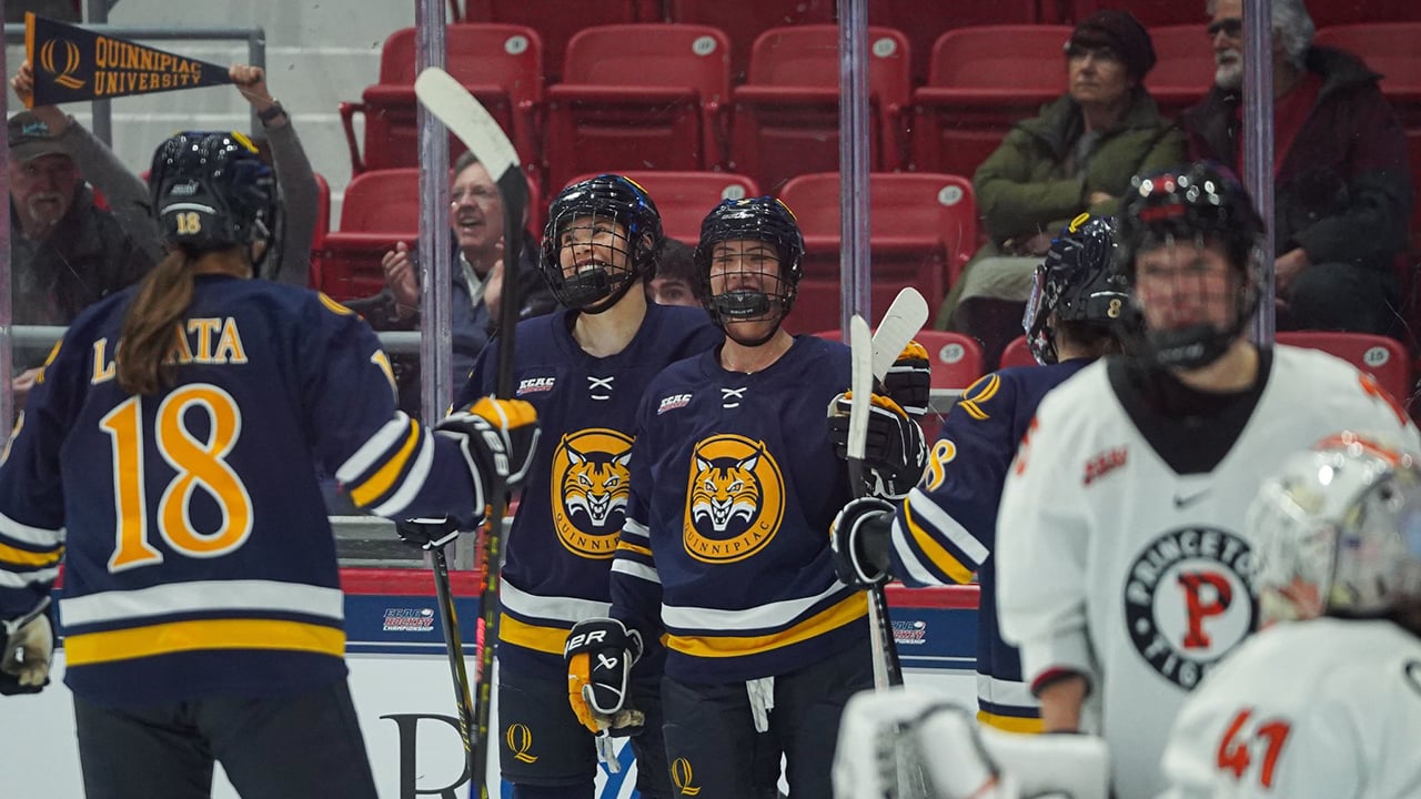 Women's ice hockey team celebrates goal at Lake Placid rink
