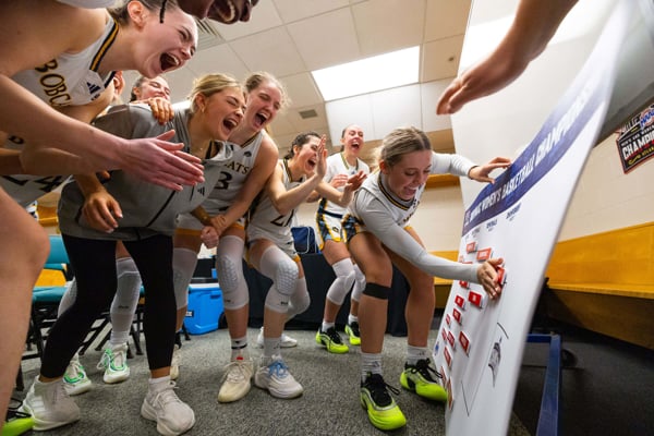 Quinnipiac women's basketball celebrates a win in the postseason.