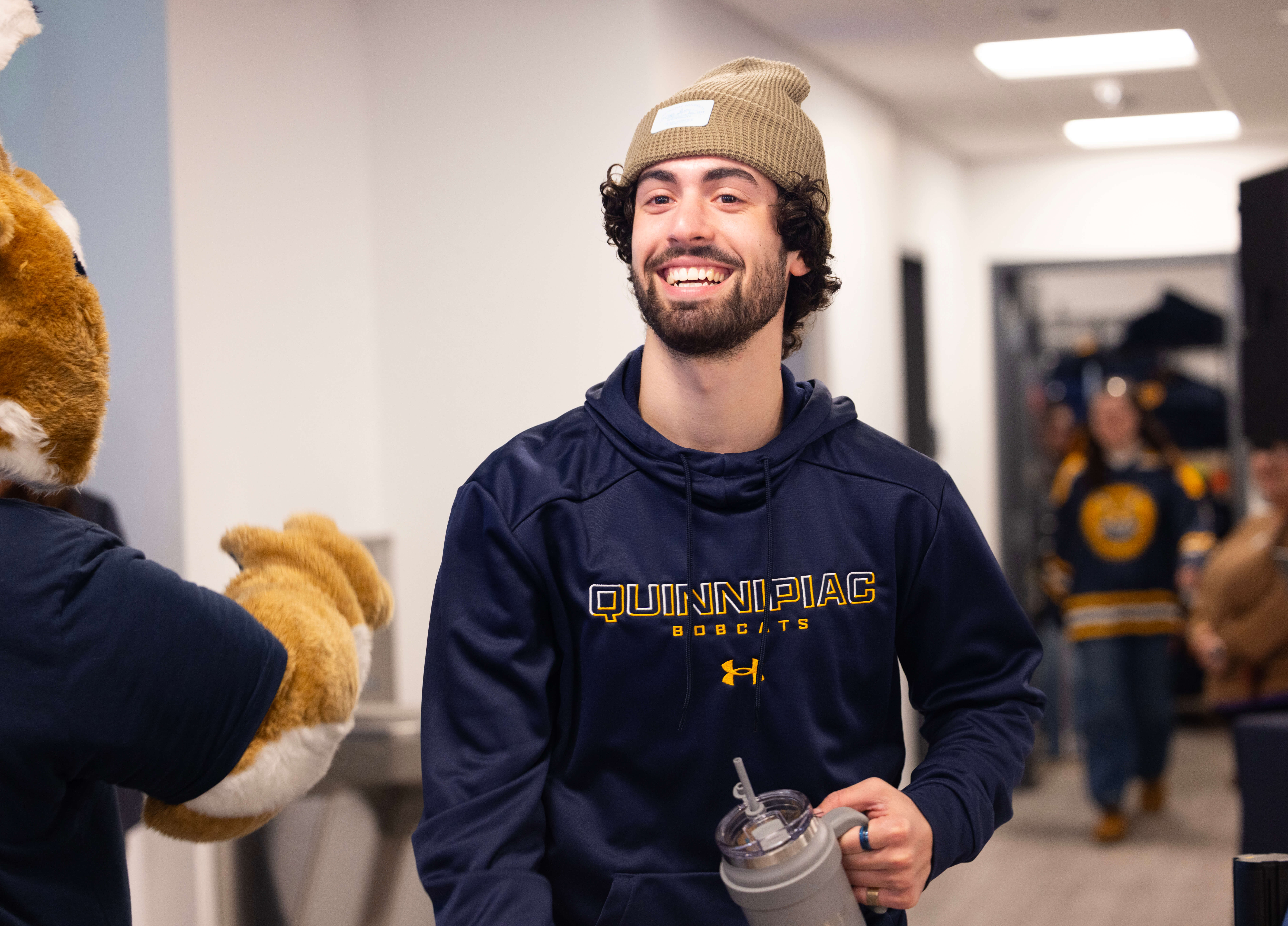 Student at Quinnipiac's bookstore ribbon cutting