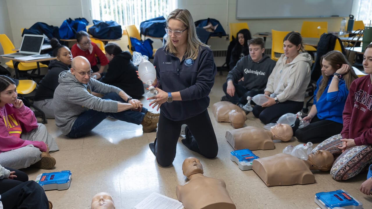 Students go through CPR training in a living learning community event.