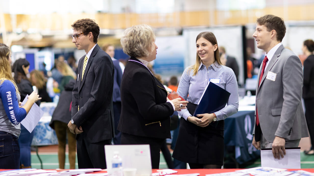 Students speaking to recruiters at the University-Wide Career Fair held in the Athletic and Recreation Center.
