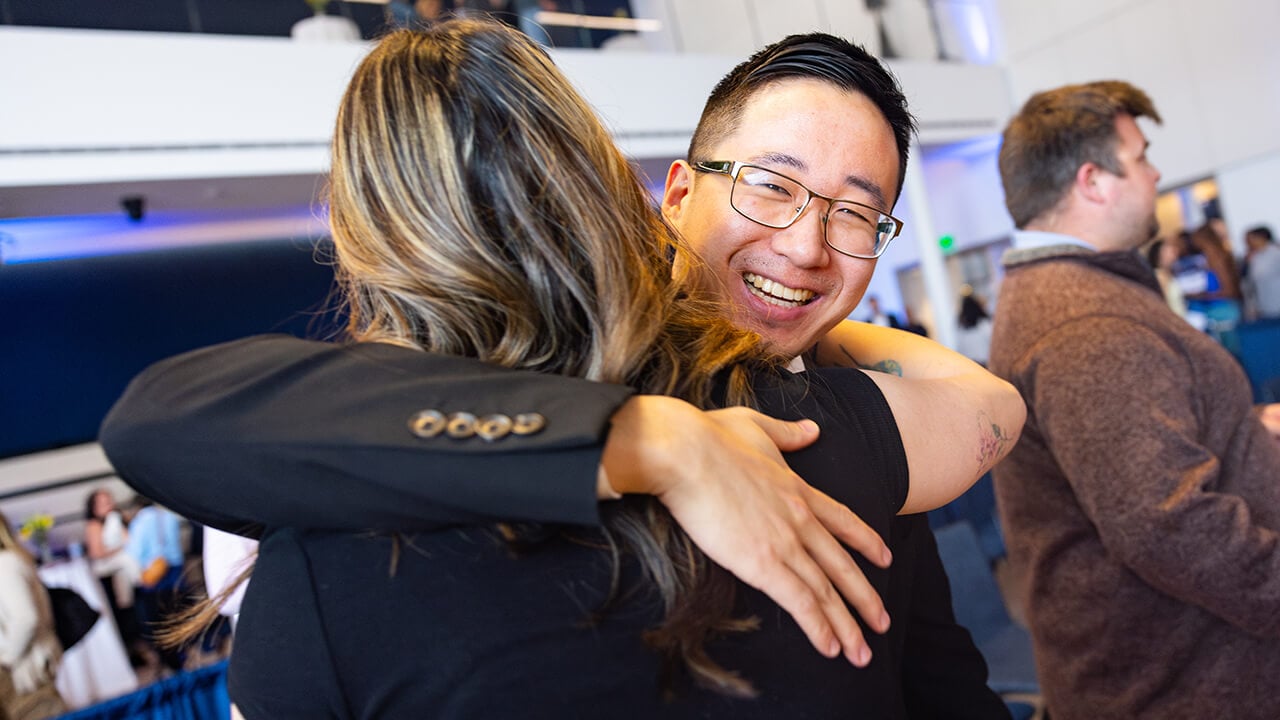Two students embracing during Match Day