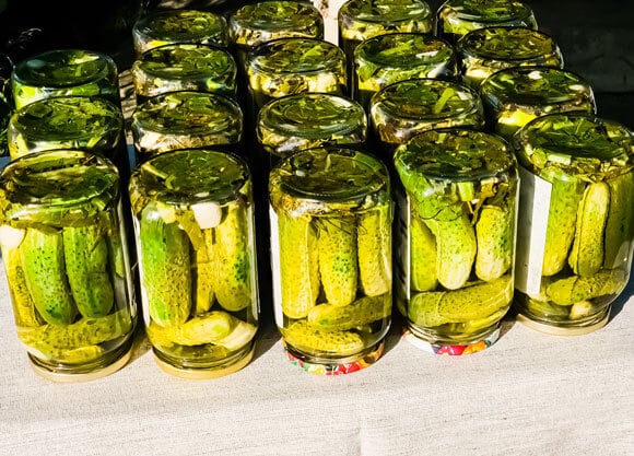 Jars of pickles on a table.