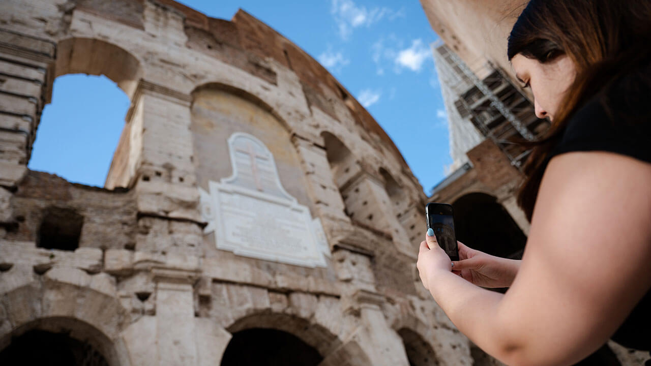 Student takes a photo of the Colosseum